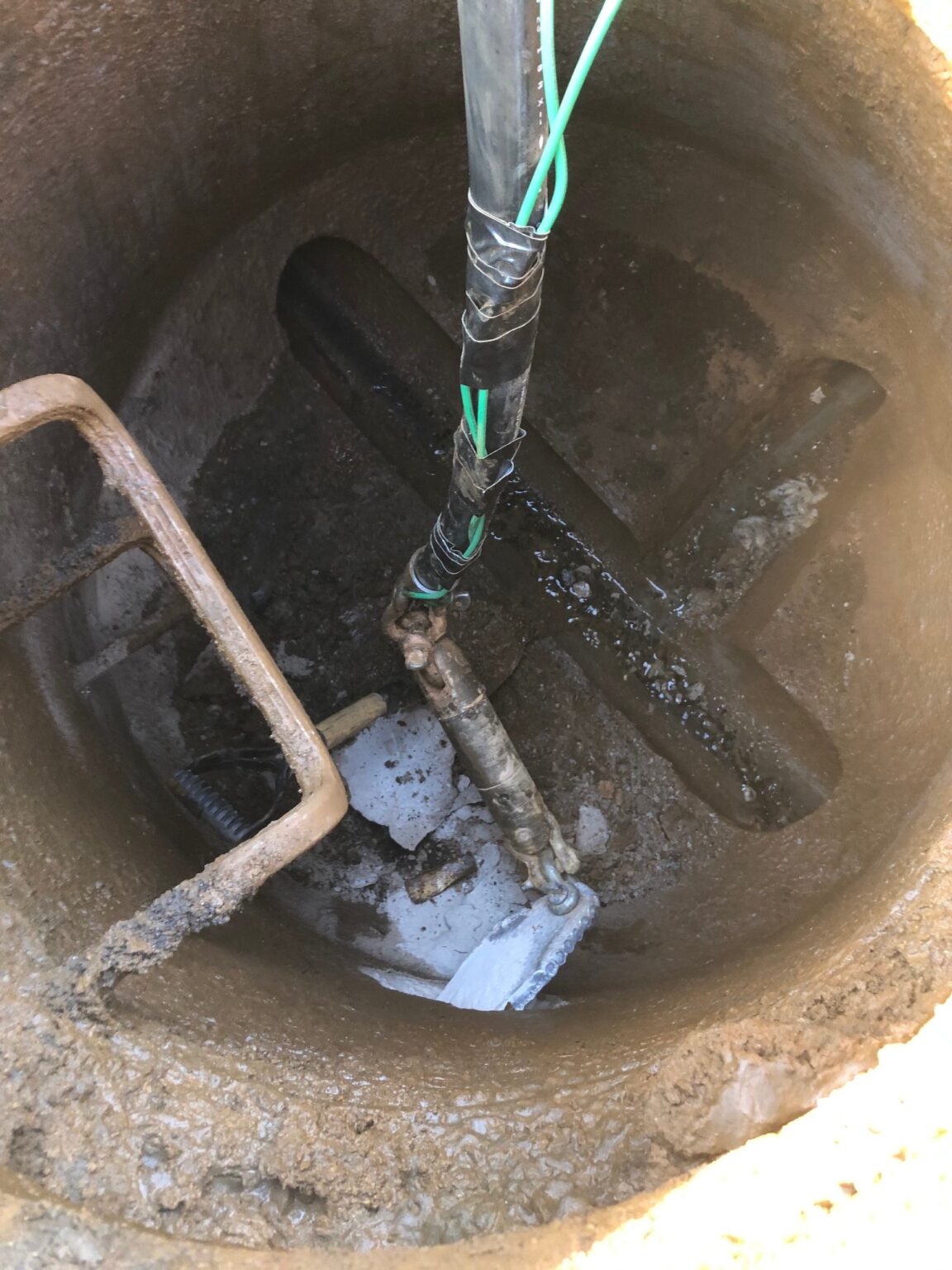 Installing 1 1/4″ Grinder Pump Line with Tracer Wire into Manhole – IZ ...