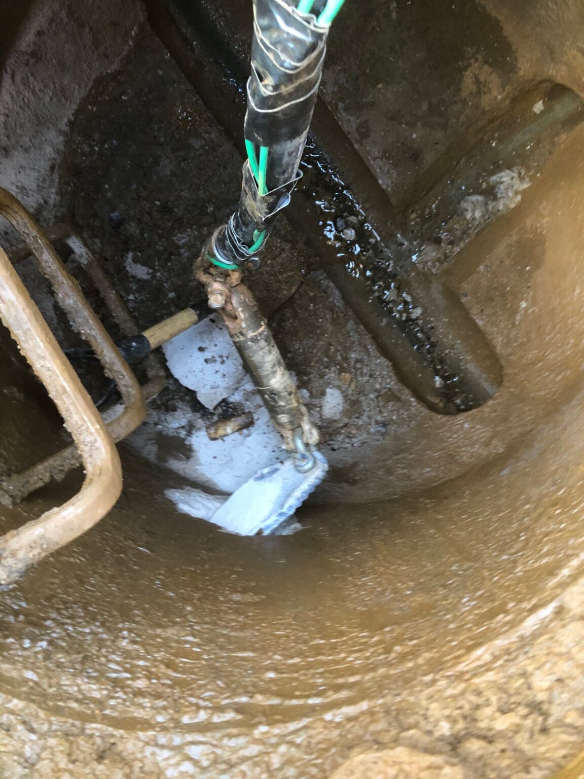 Installing 1 1/4″ Grinder Pump Line with Tracer Wire into Manhole – IZ ...